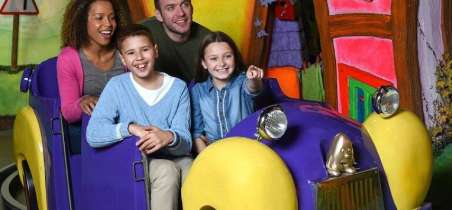 Family enjoying a colorful amusement ride at Cadbury World Birmingham