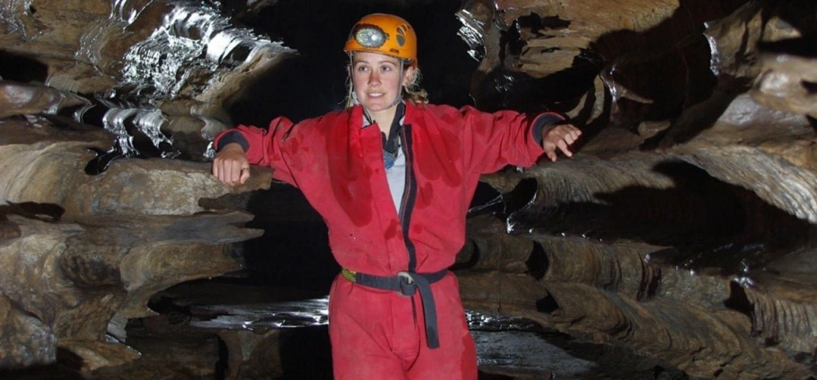 Glamorgan Caving Adventure: a young lady posing for a photograph in a cave.