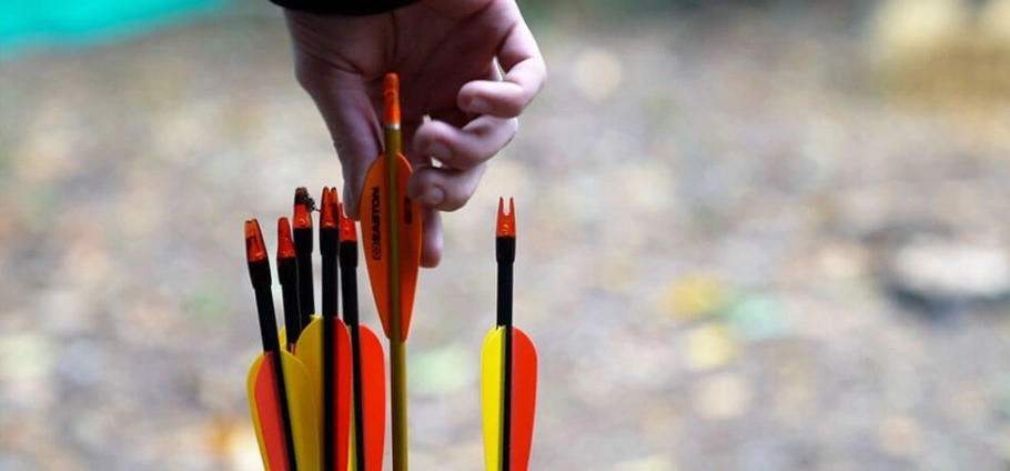 Hand picking an arrow from a quiver, archery equipment, close-up shot at the Woodland Archery Experience Near Birmingham