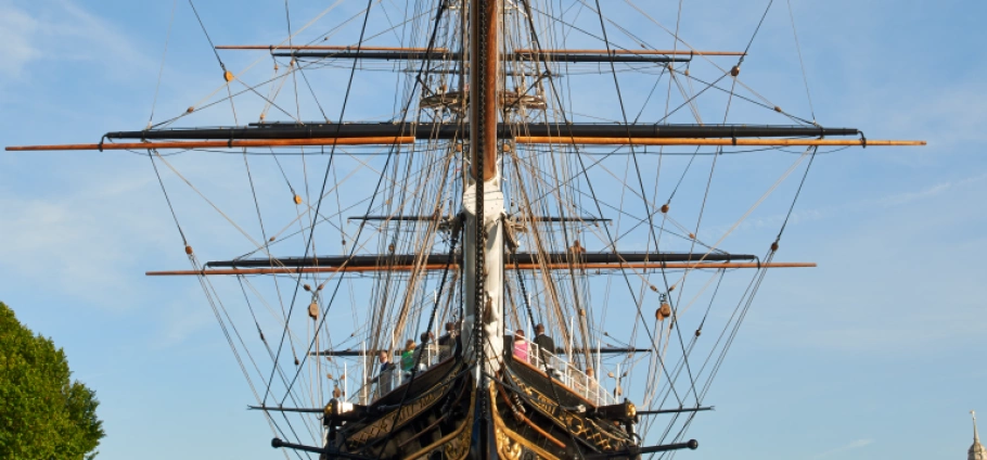 Cutty Sark Afternoon Tea and Boat Tour for Two | Historic sailing ship with intricate rigging and masts against a clear blue sky.