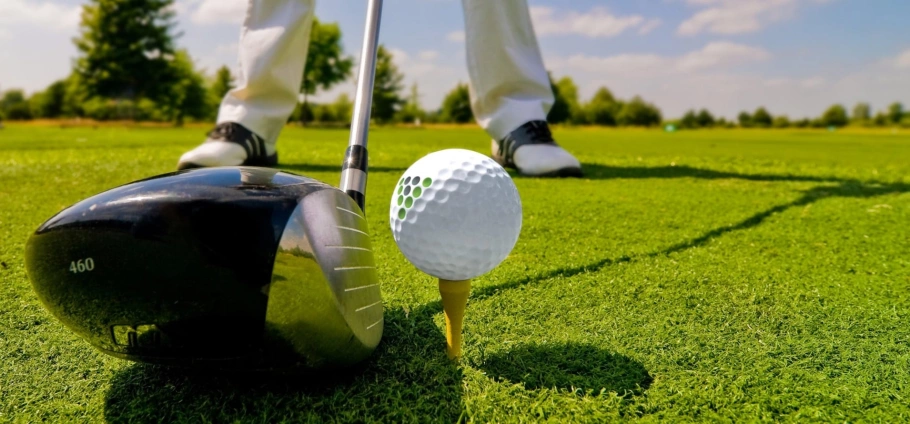 PGA Professional 30 Minute Golf Lesson | Golfer preparing to tee off with driver on a sunny day at a golf course