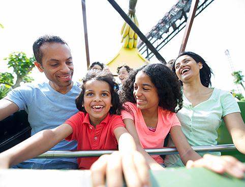 THORPE PARK Resort | Family enjoying a roller coaster ride at an amusement park on a sunny day