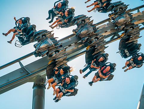 THORPE PARK Resort | Thrill-seekers riding an inverted roller coaster on a sunny day